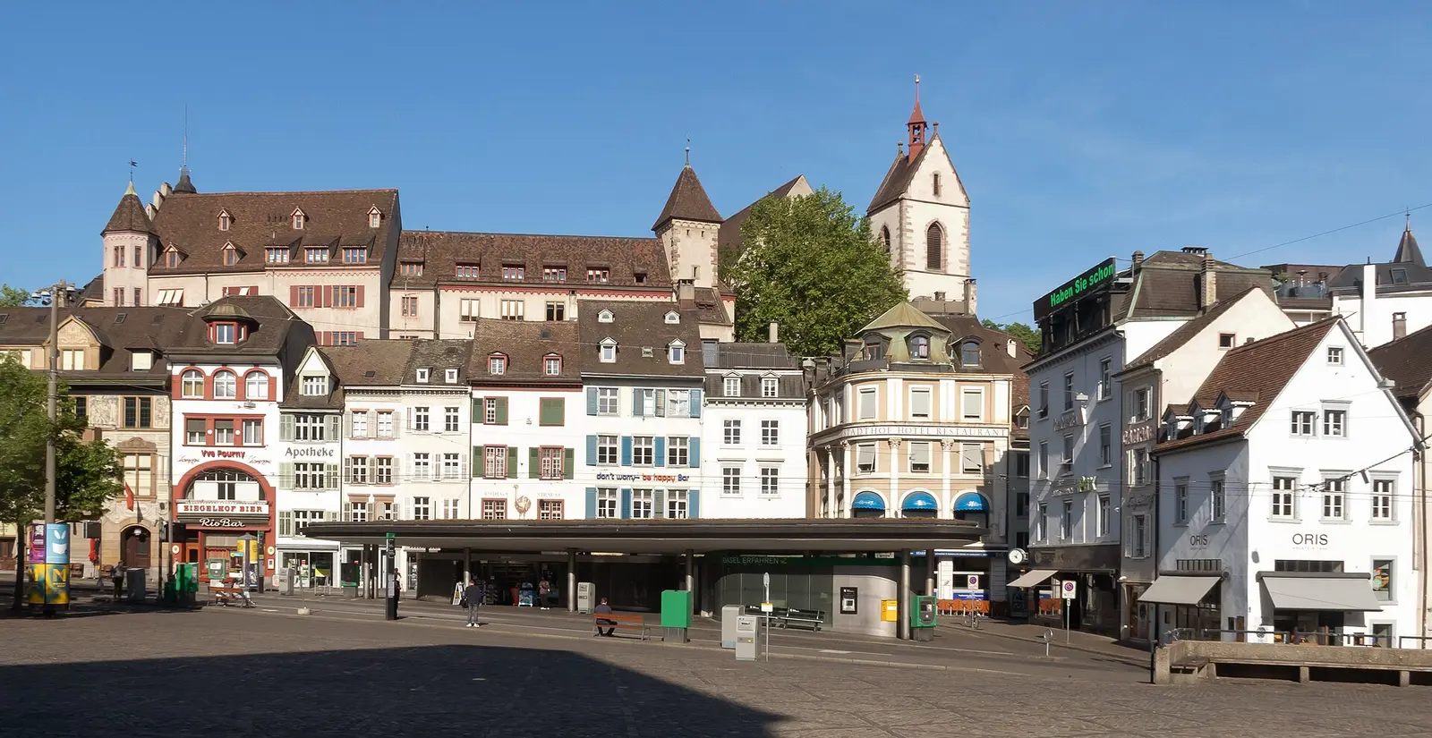 Barfüsserplatz square in Basel with historic houses and church tower