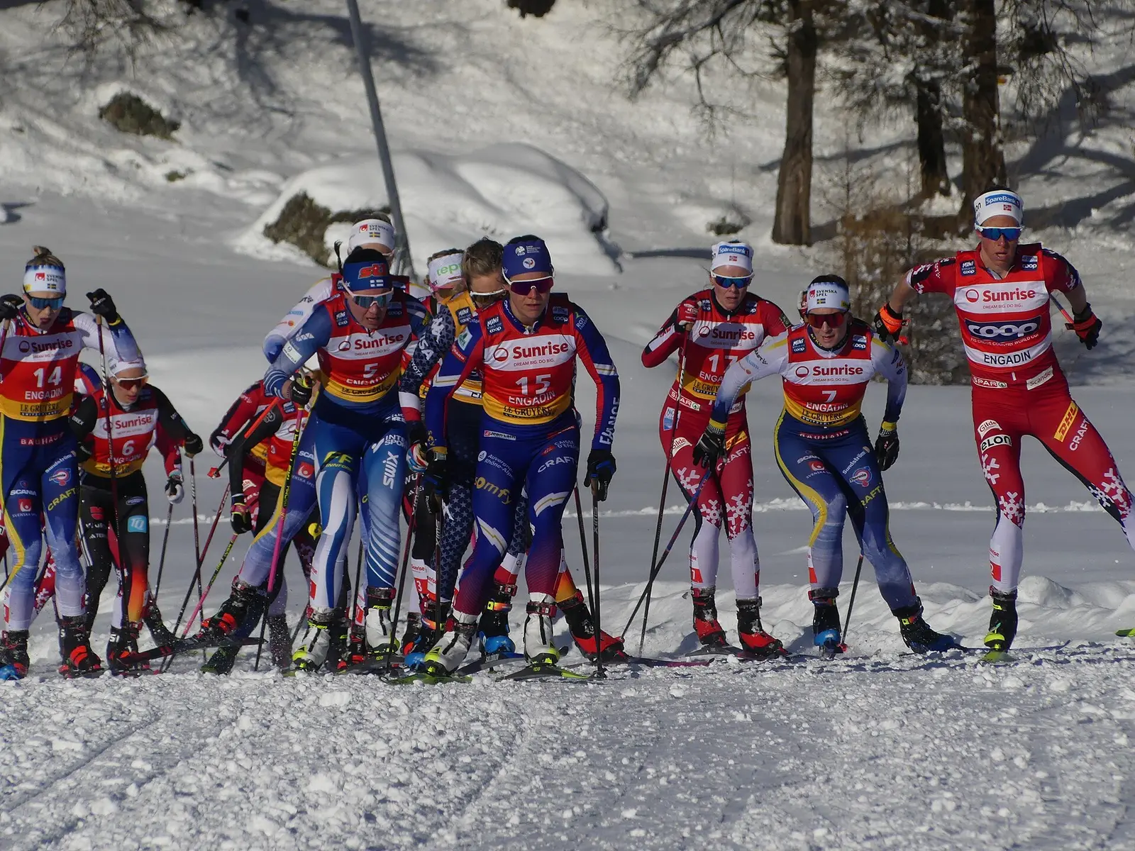 Pack of women cross-country racers on the snowy course at Silvaplana