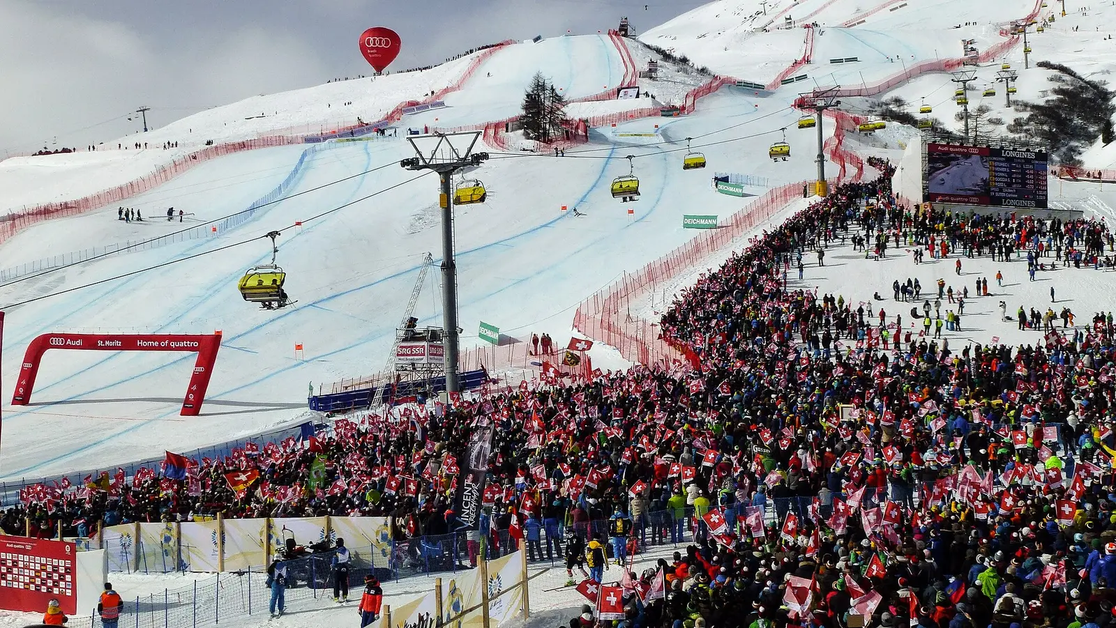 Spectators packing the finish area below the ski course at St. Moritz