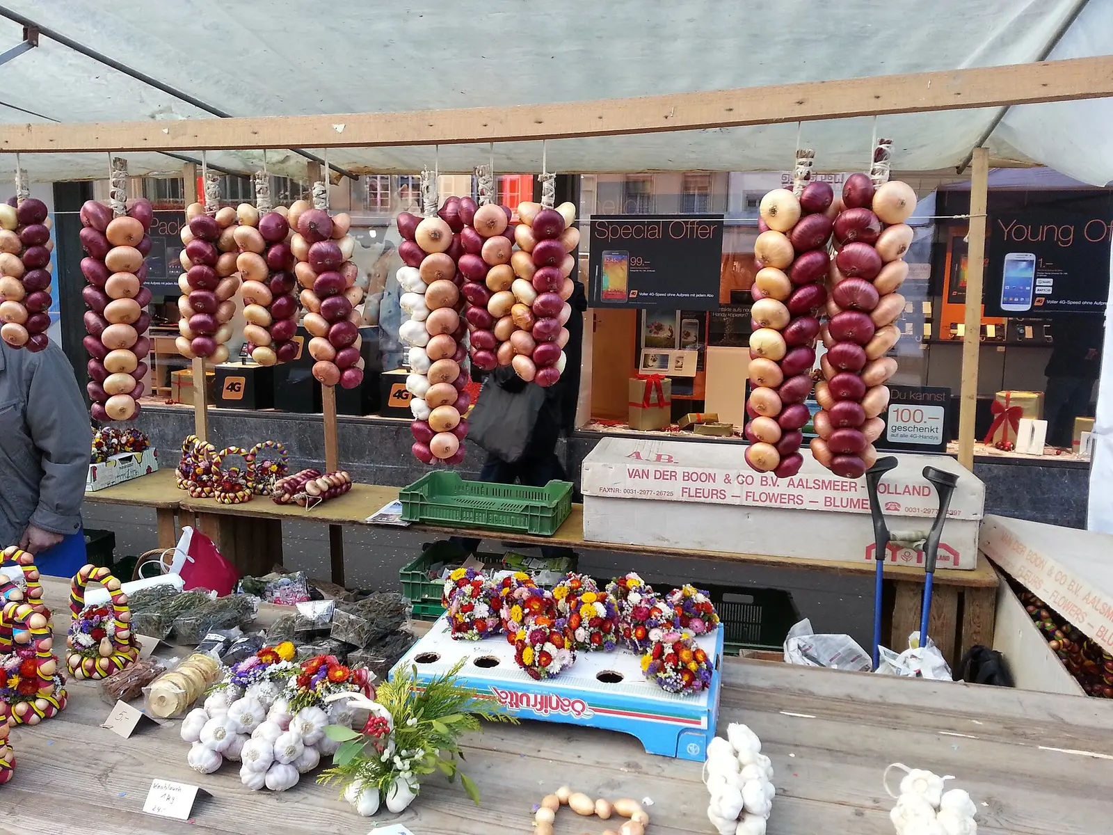Market stall hung with braided onion garlands at the Bern onion market